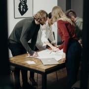 inception-app-prod/YmI4ZWFlZWEtNjUyZC00NjRhLTlkNTgtY2M2MGUyYzEwNzRi/content/2019/12/women-and-men-standing-near-table-32055681.png