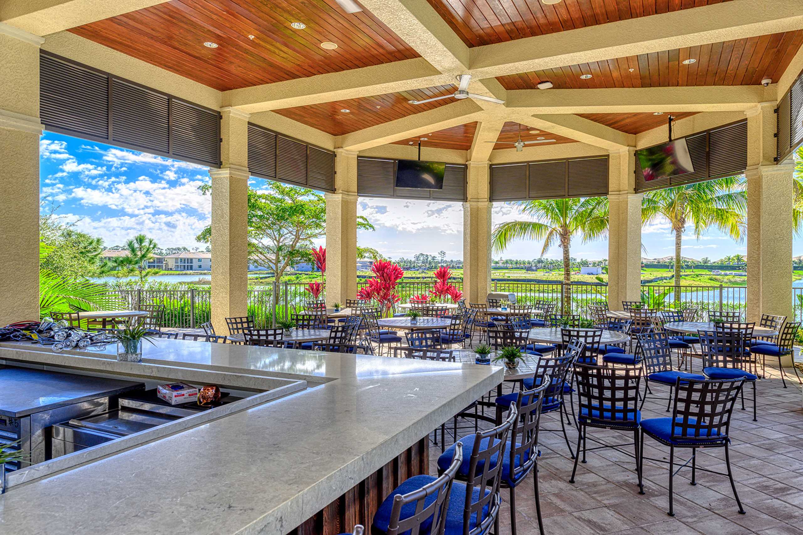 Residents enjoy a poolside restaurant