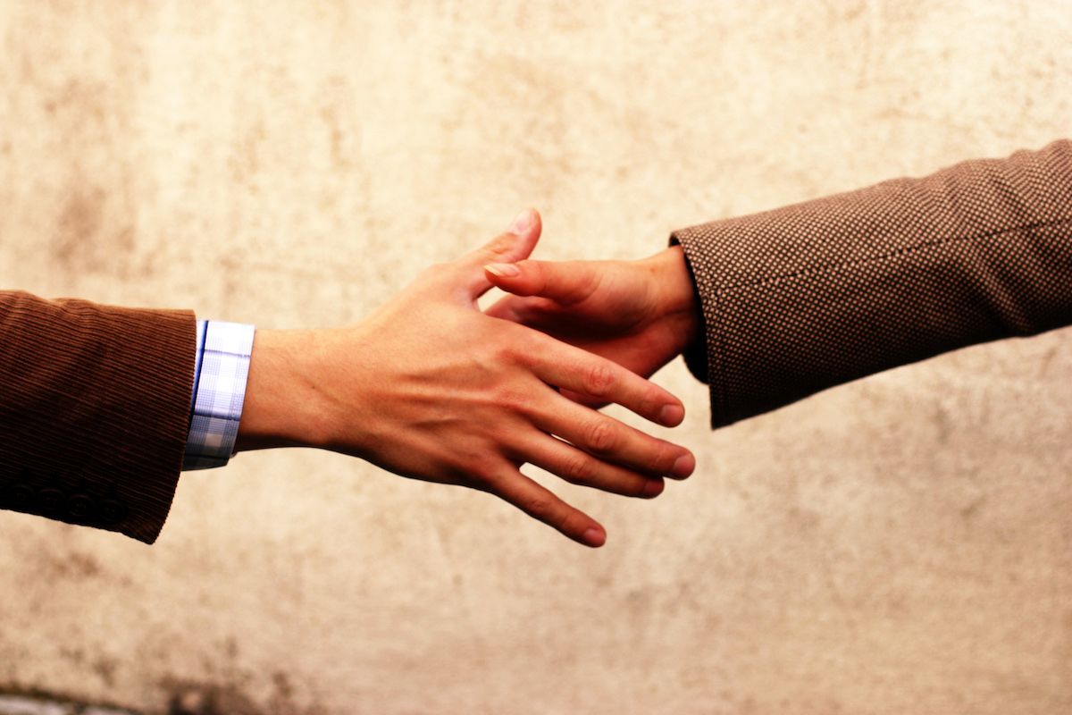 realtor shaking hands with client