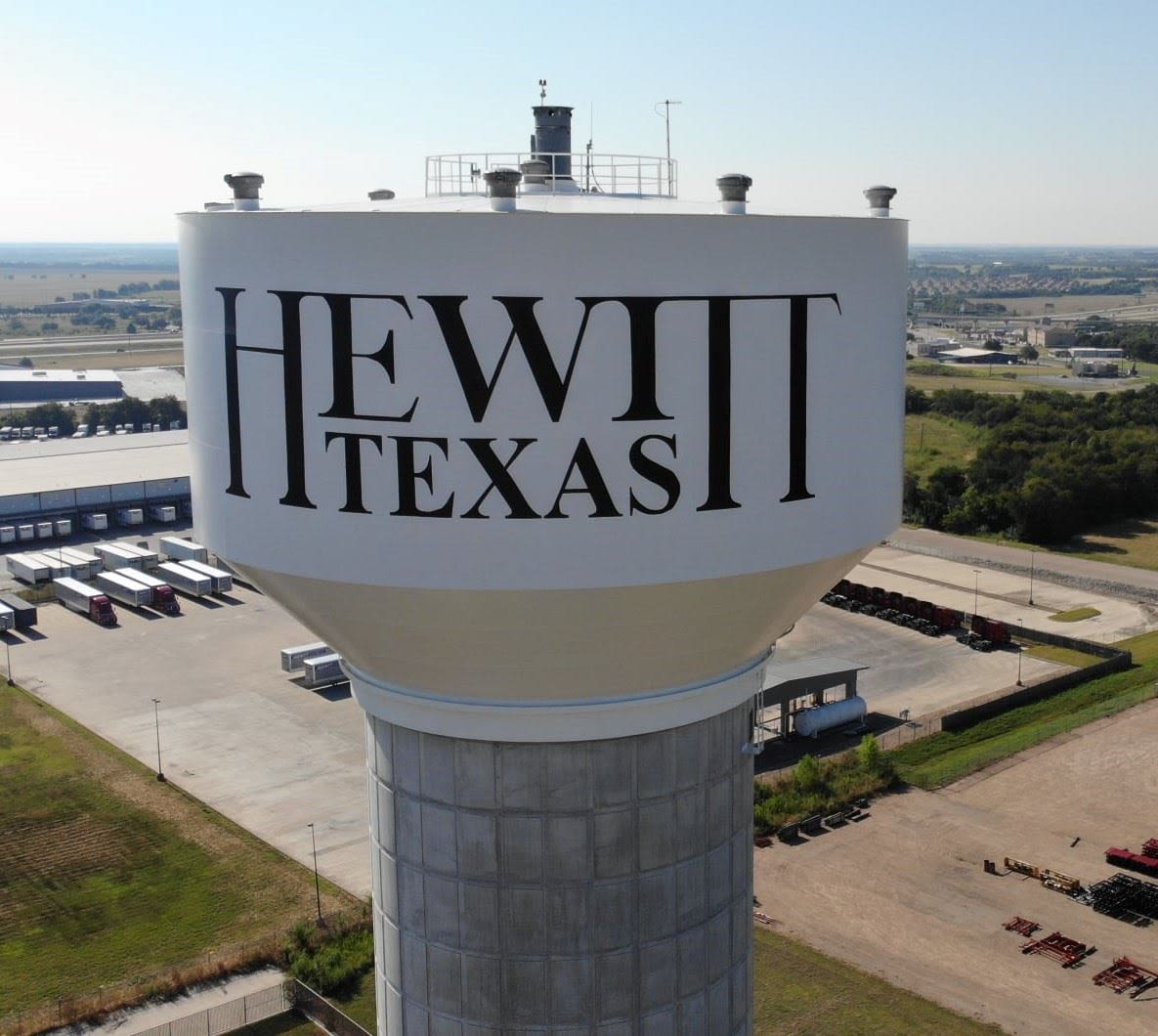 Hewitt Texas Water Tower - Homes for Sale in Hewitt, TX Arieal photo of Hewitt Texas Water tower that says Hewitt Texas on the side of it