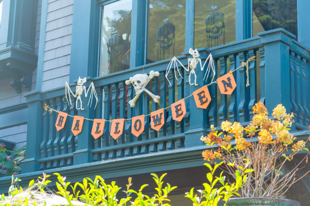 Halloween-banner-hanging-on-a-balcony Halloween banner hanging on a balcony