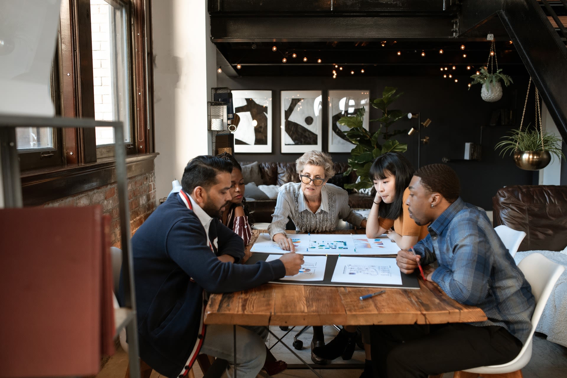 People sitting at table in office