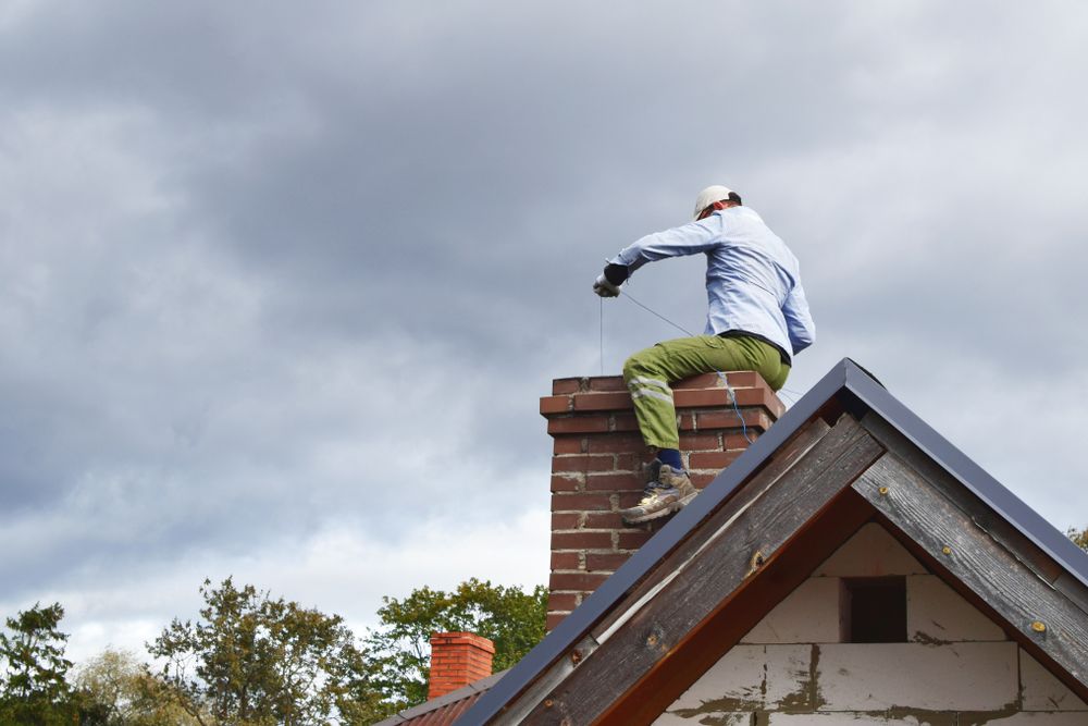 Man-Checking-The-Chimney Man Checking The Chimney