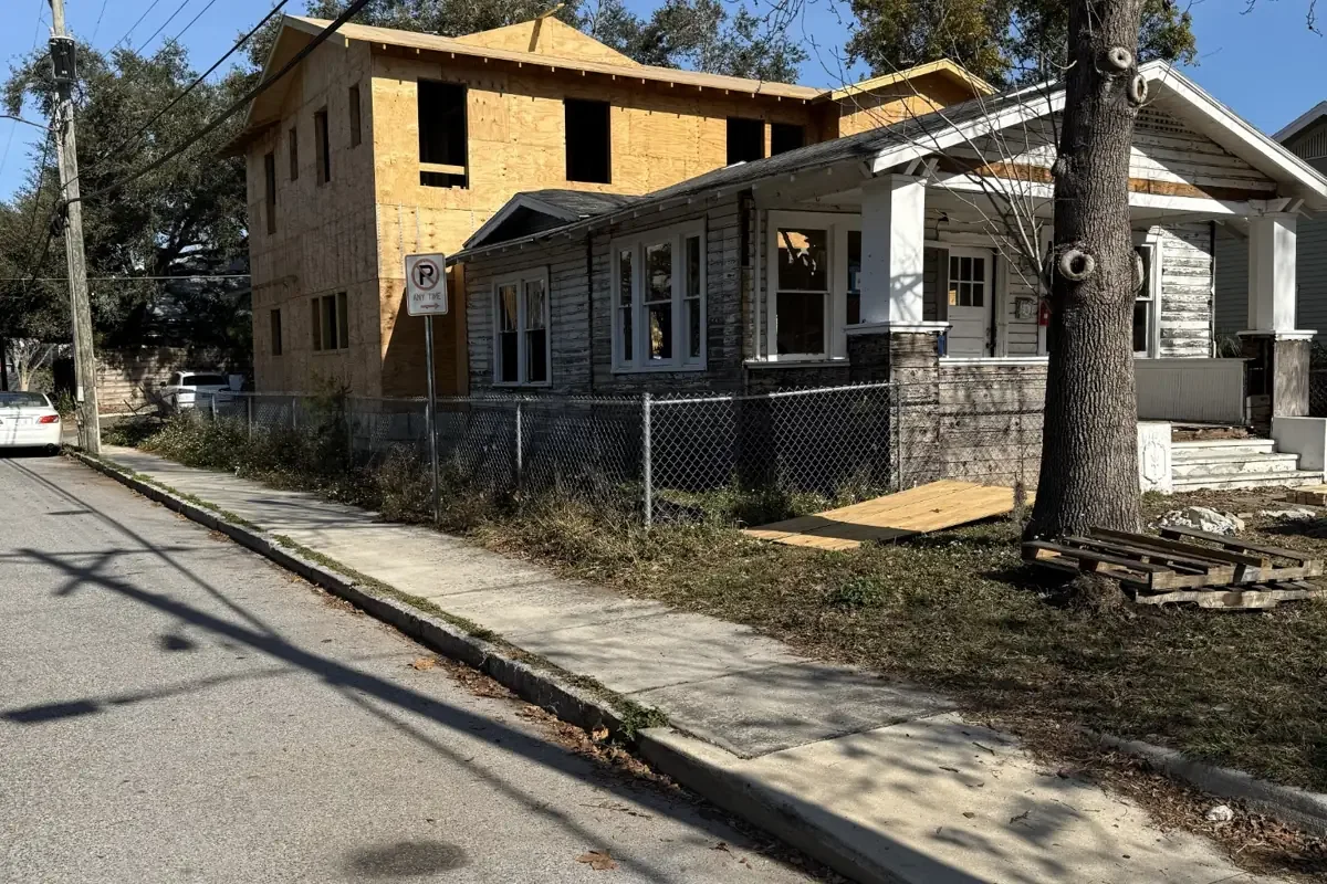 hyde-park-renovation-front-street-view.jpg Front street view of the Hyde Park home renovation showing the original bungalow and new two-story addition under construction.