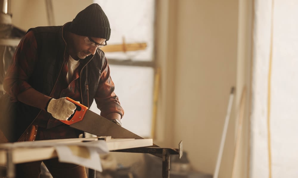 man-working-on-reclaimed-wood man working on reclaimed wood