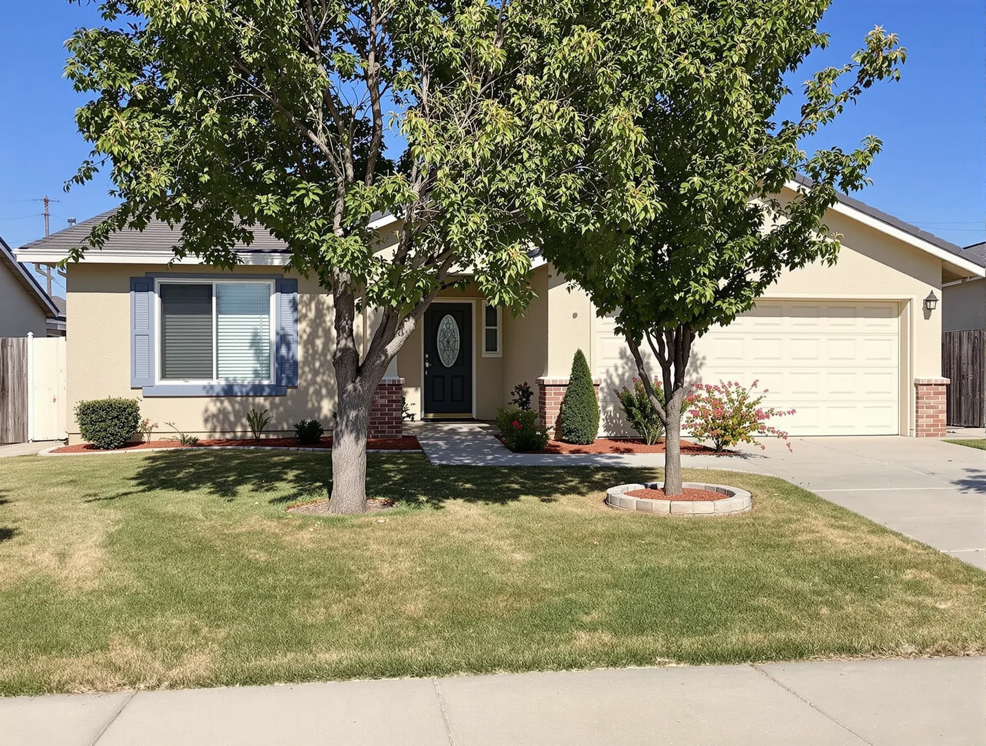 Well-maintained single-family home exterior with simple landscaping in Oildale