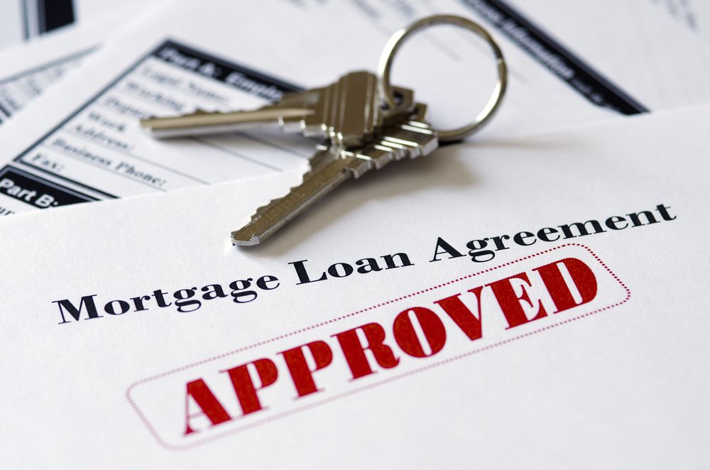 house-key-with-mortgage-approval-document house key with mortgage approval document
