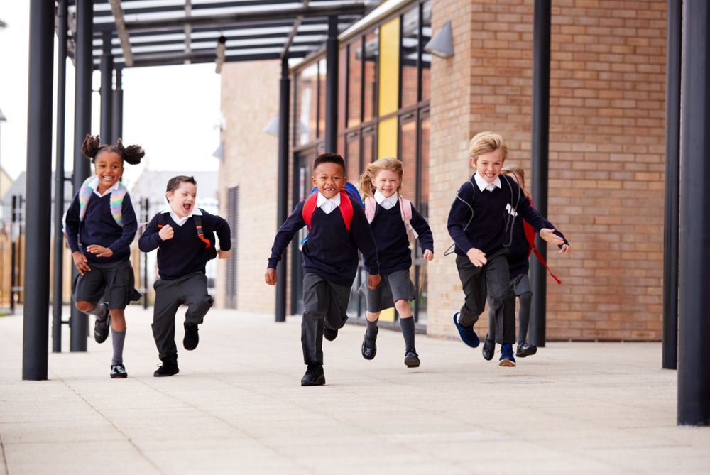 kids-running-in-uniform-at-school kids running in uniform at school