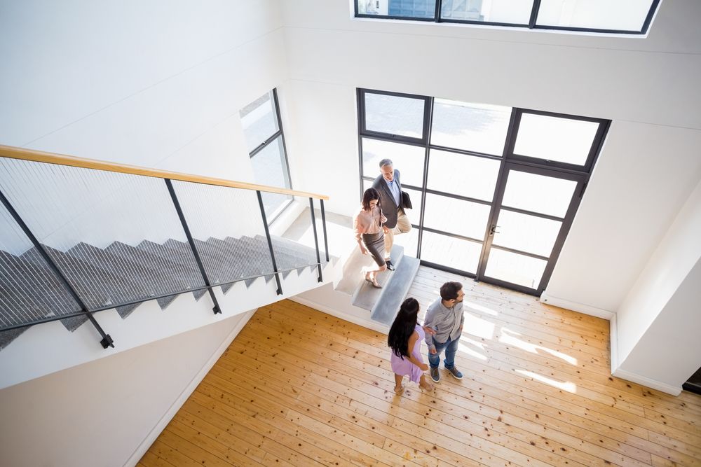 couple-checking-the-house-with-the-broker