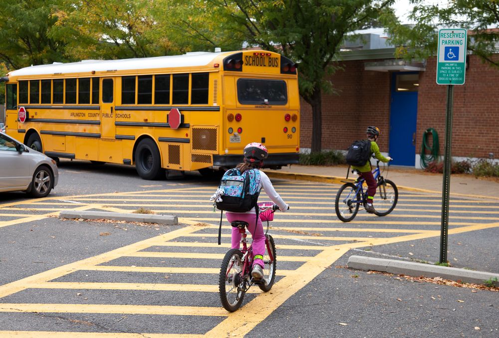 kids-riding-their-bikes-going-to-school kids riding their bikes going to school