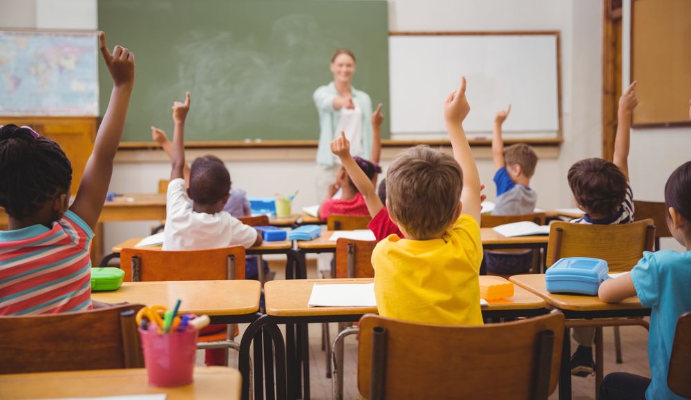 Students-in-class-with-teacher-recitation Students in class with teacher recitation