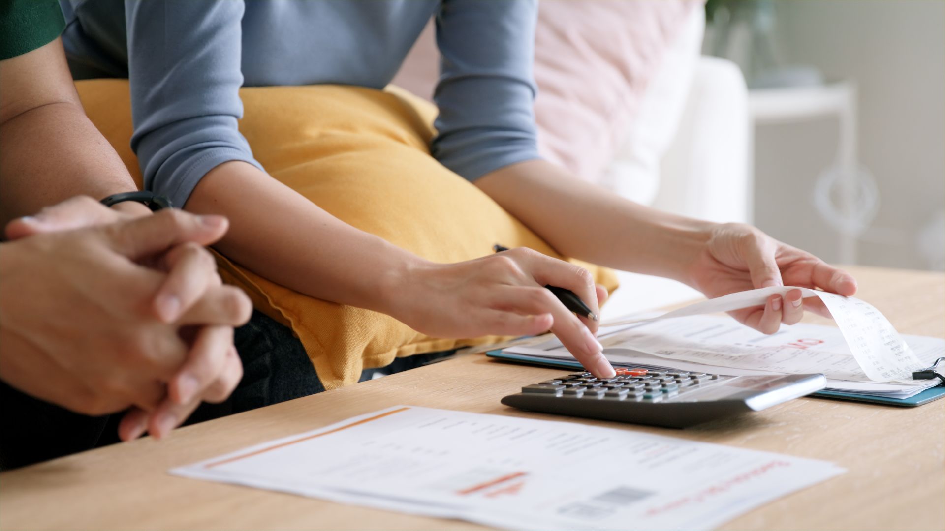 couple-with-pen-and-calculator-taxes couple with pen and calculator taxes