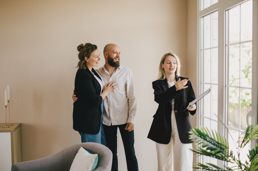 real-estate-agent-showing-home-to-client real estate agent showing home to client