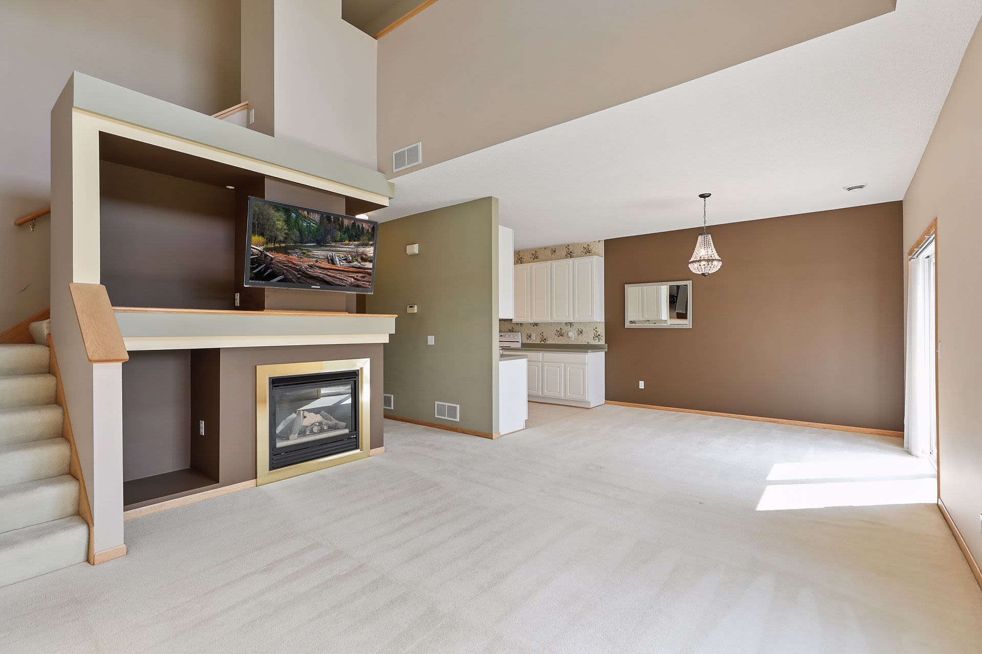 vaulted living room with gas fireplace