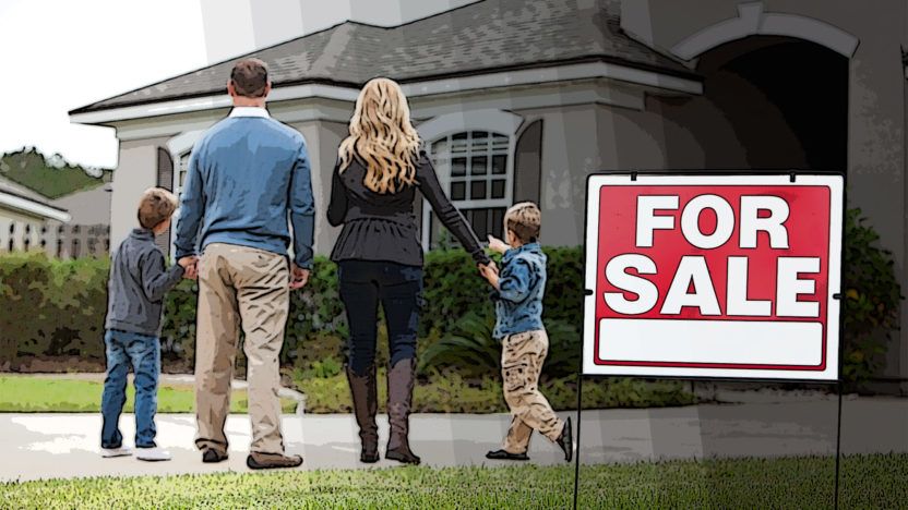 Family in front of home for sale
