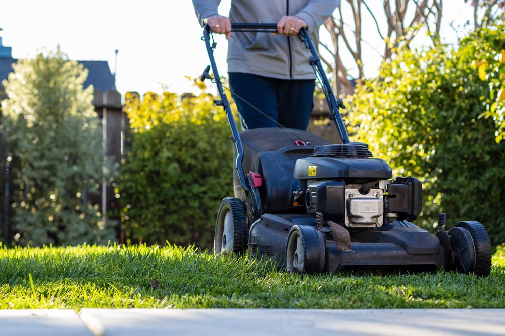 A person mowing the lawn