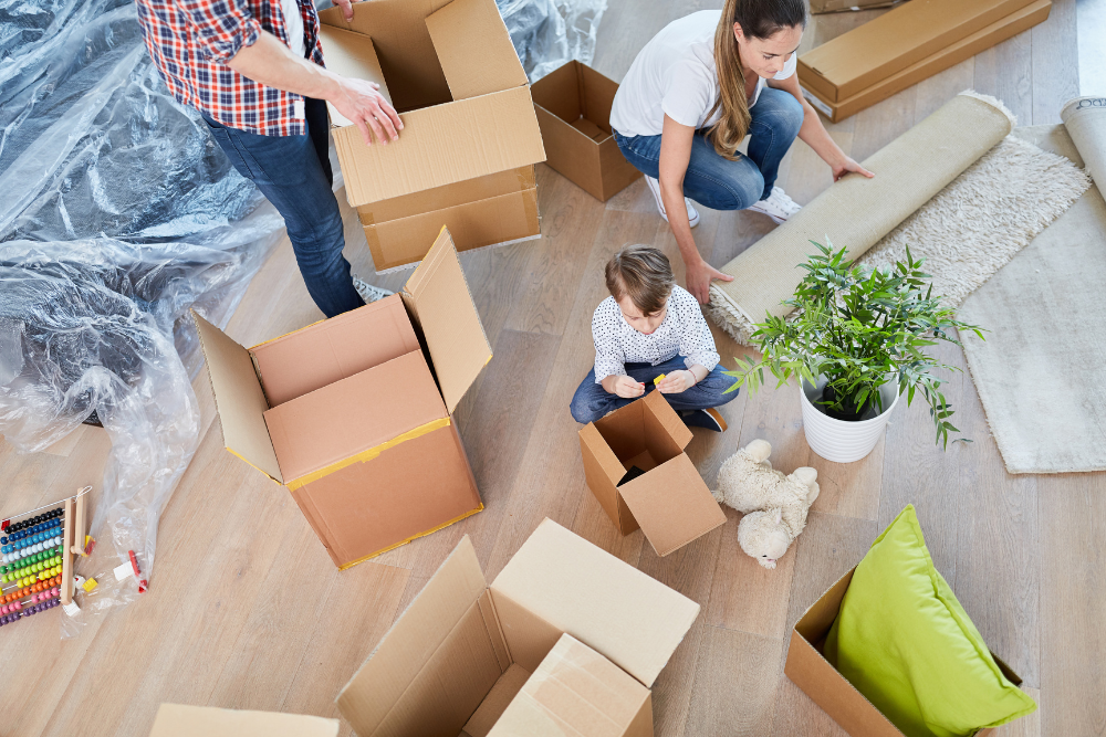 family arranging fixing stuff in boxes