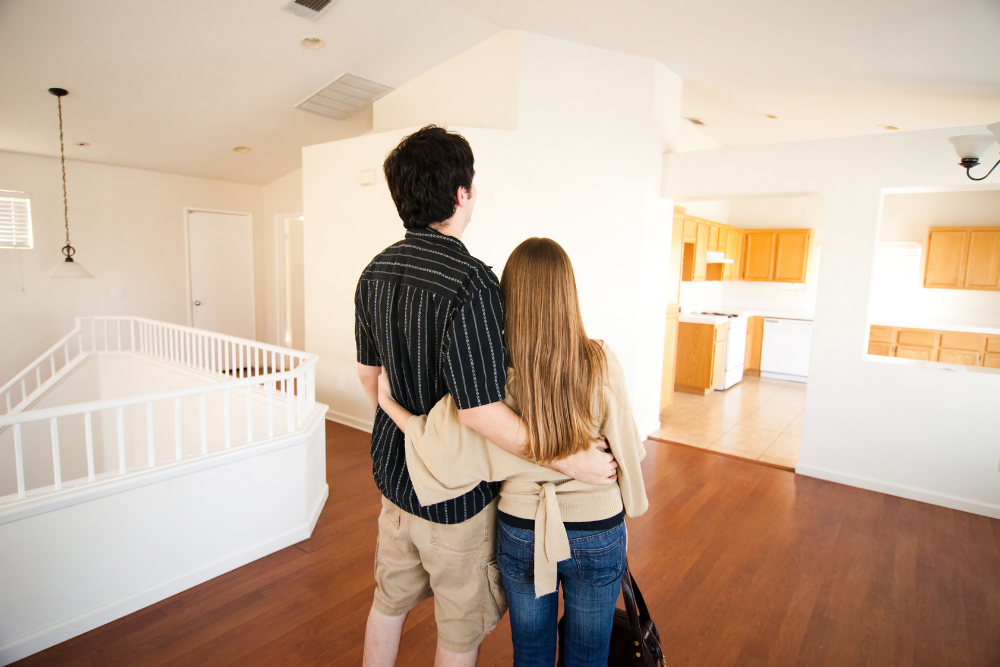 couple looking at the house first time home buying