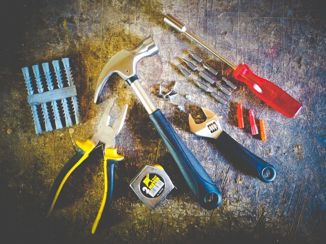 Focus on major structural or safety issues A set of tools on a wooden surface