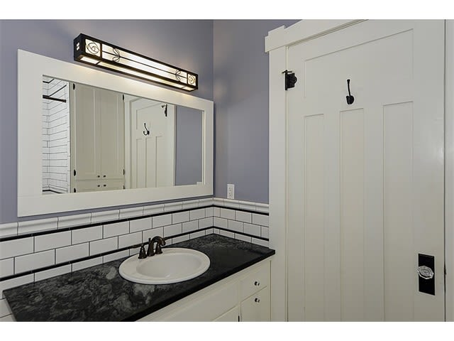Classically remodeled Bath with mosiac and subway tile