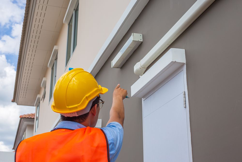 a person pointing to the building