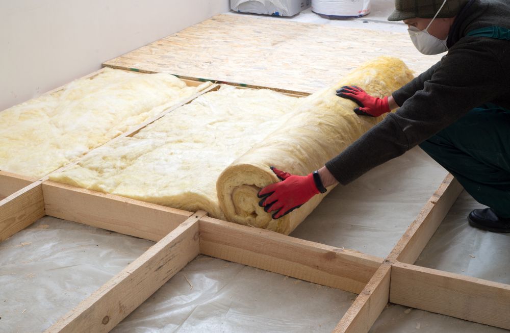 A-worker-preparing-insulation-and-ventilation A worker preparing insulation and ventilation