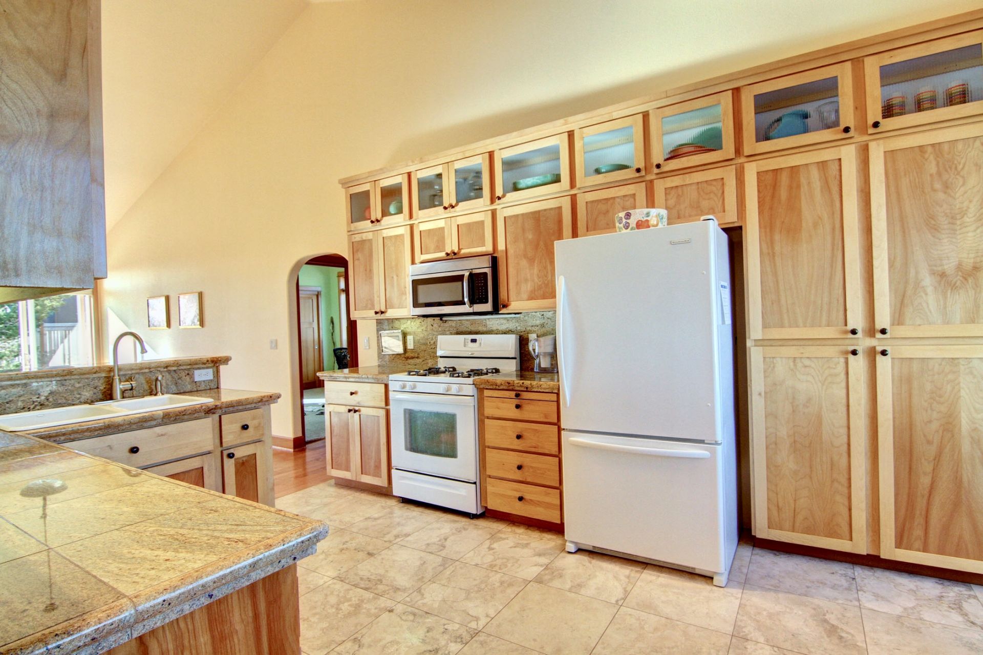 Spacious kitchen with beautiful custom cabinetry.  