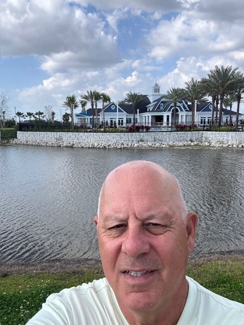 In Front of Clubhouse Palmera Amenities Advancing at Palmera