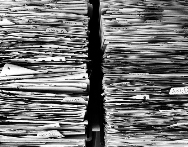 2 Piles of Old Paperwork