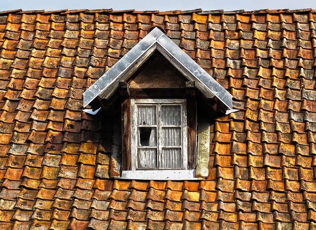 Old Roof with shattered window needing repair
