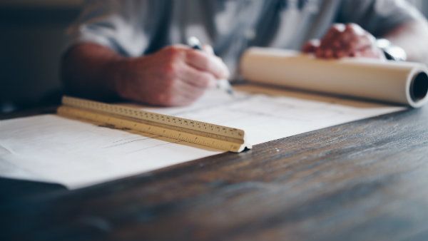 HomeInspector taking notes during an home inspection
