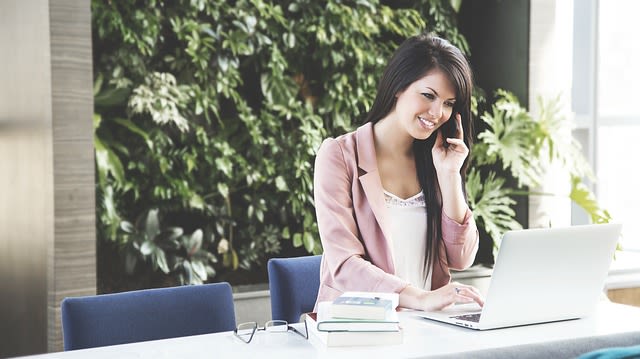 A woman communicating over the phone