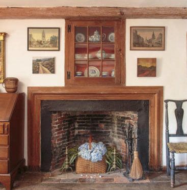 An Image of an old historic fireplace in house in Cape Cod