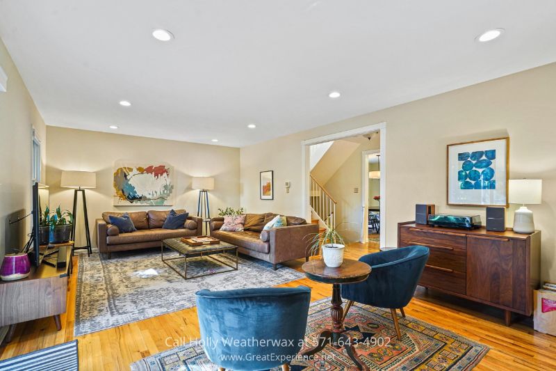 Homes in Reston VA - Floor-to-ceiling windows give this living room in Reston VA its warm and inviting ambiance. Homes in Reston VA