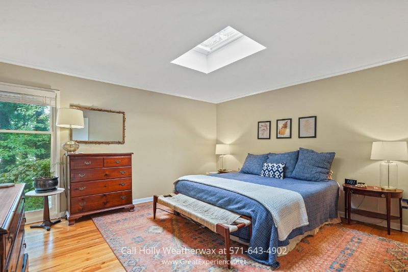 Homes for Sale in Reston VA - Remote-controlled skylights and chic interior design make the primary suite of this Reston VA home a haven. Homes for Sale in Reston VA
