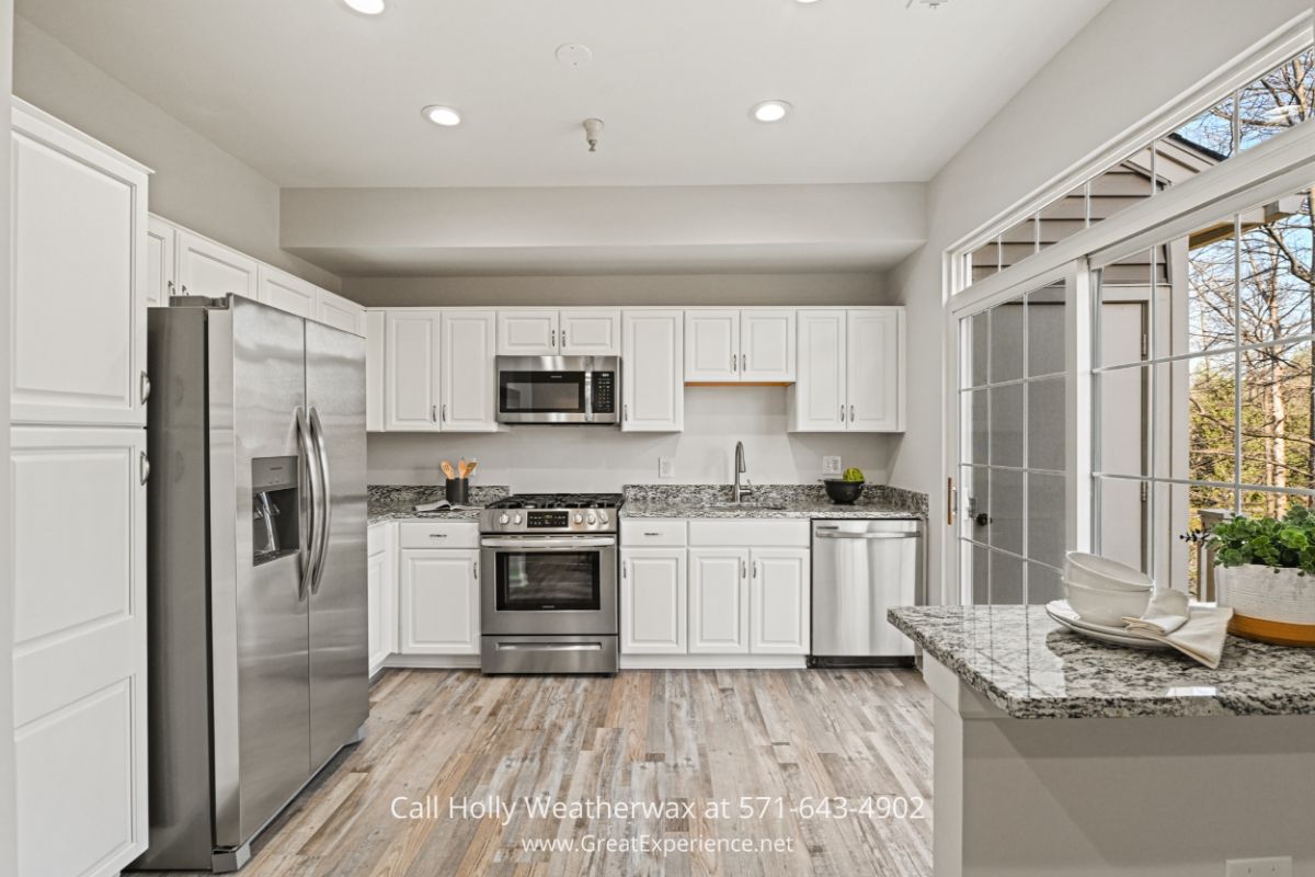 Condo for Sale in Reston VA - Cooking is a breeze with the high-end appliances in the modern kitchen of this Reston VA home. Cook up a storm with the latest appliances and indulge in the peace and quiet on your very own balcony.