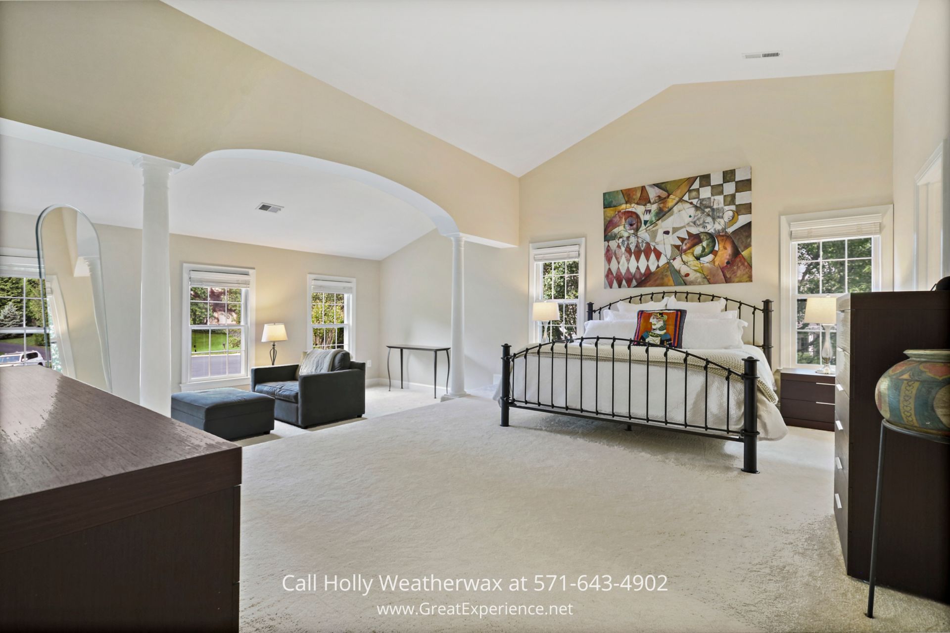 Single Family Home for Sale in Reston VA - Every day will feel like a five-star hotel experience in the primary bedroom of this Reston VA home. Cozy bedroom with a spacious bed and captivating wall painting