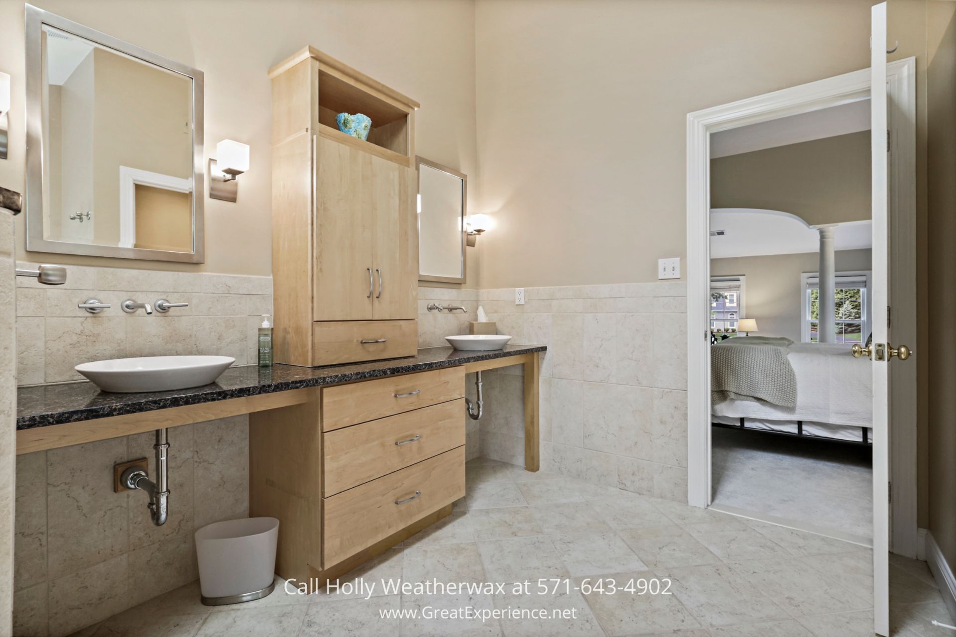 Reston VA Home Listings - Modern bathroom with double sinks, soaking tub, and standalone shower. Modern bathroom with dual sinks and a stylish mirror