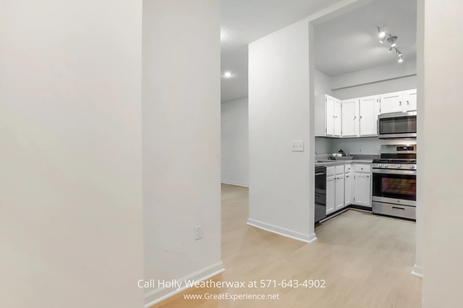 Move-in-Ready Condo in Reston VA - You will love the new Luxury Vinyl Plank and the rest of the modern updates in this condo in Reston VA A sleek stainless steel stove, cabinets, and microwave in a kitchen