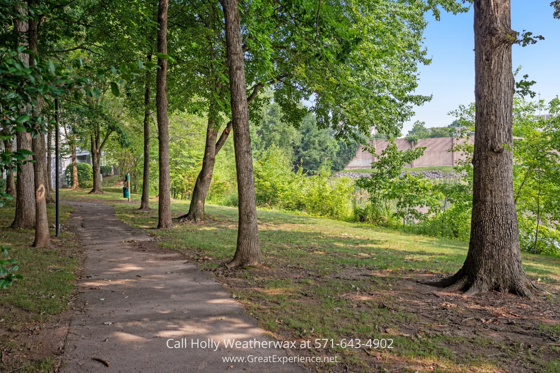 Reston VA Property for Sale - This ideally located condo for sale is close to all the entertainment and shopping in Reston. A scenic path in a park lined with trees