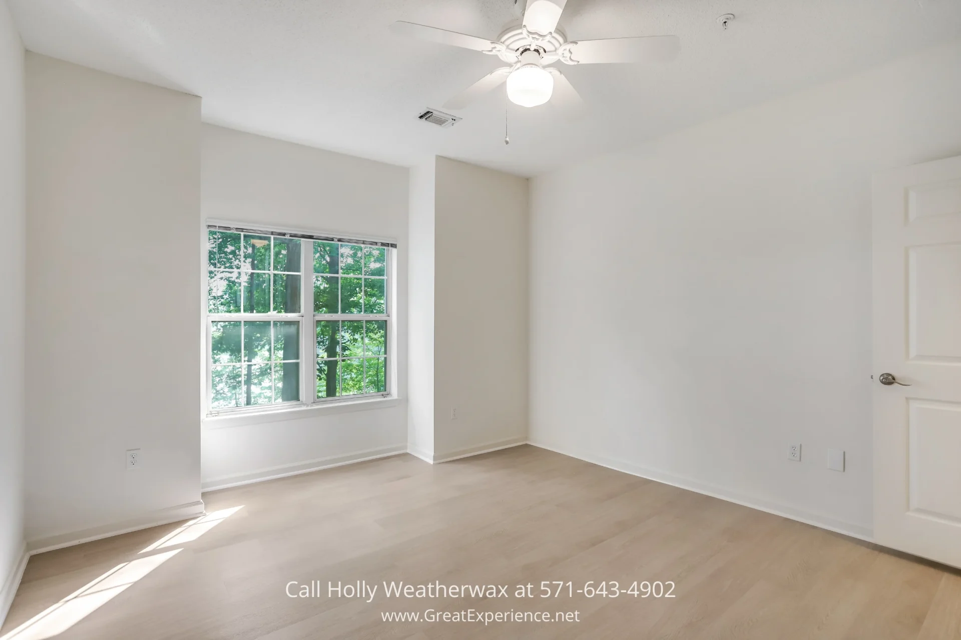 Condo in Reston VA - The spacious bedroom of this condo serves as a perfect sanctuary after an eventful day in Reston VA An empty room with white walls and wood floors