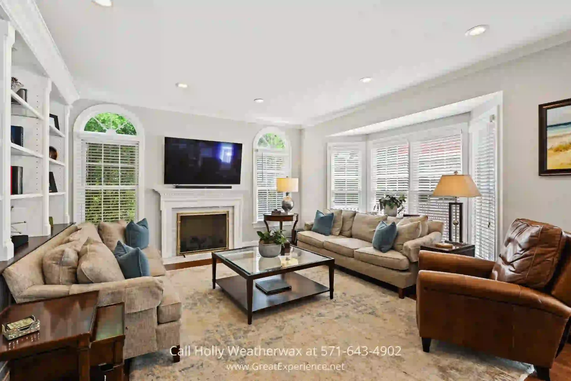 Luxurious Reston VA Home - Experience a functional floor plan and ample outdoor space in this stunning property! a family room filled with furniture and a fire place