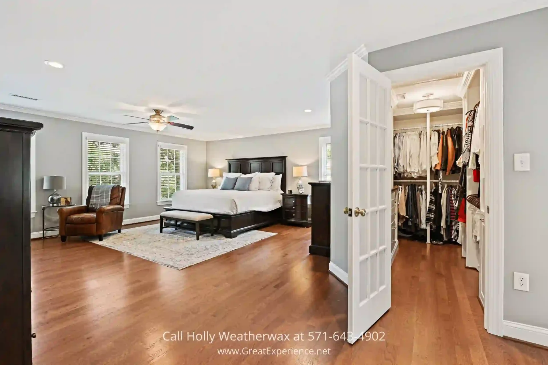 Single-Family Home for Sale in Reston - The primary bedroom of this home in Reston VA has a walk-in closets designed by a true artisan. a bedroom with a bed and a closet