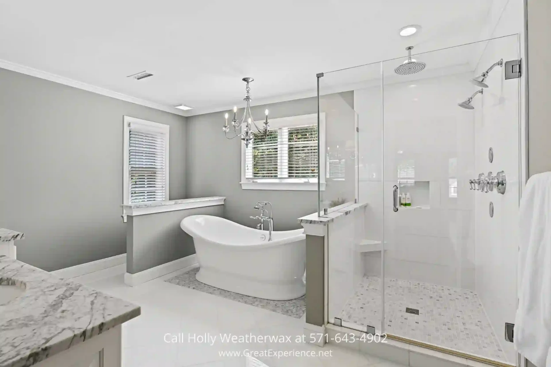 Luxurious North Reston Home For Sale - Experience the elegance of this exquisite residence in North Reston, VA, situated on over ½ acre of pristine land. a white bath tub sitting next to a walk in shower