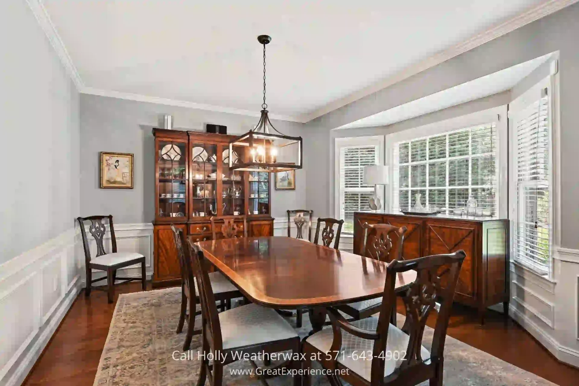 Reston VA Detached Home - Sophisticated dinner parties are perfect in the dining room of this Reston VA Home. a dining room with a wooden table and chairs