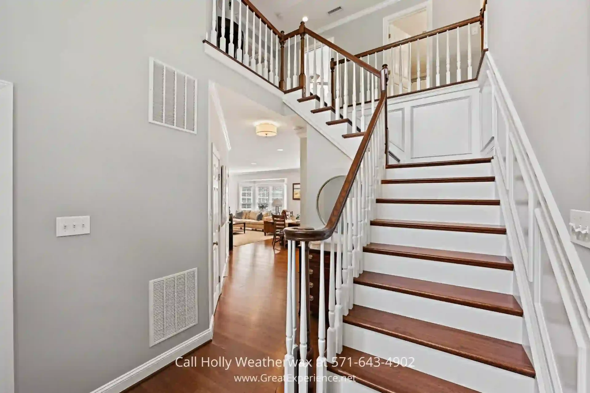 North Reston Home For Sale - A luxurious home in North Reston VA on more than ½ acre. a staircase leading to a living room and dining room
