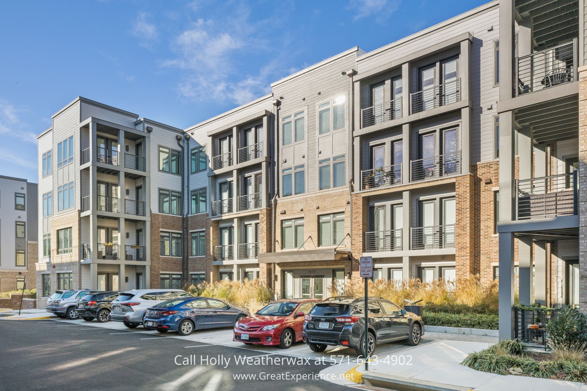 Homes for Sale in Reston - Tranquil condo entrance surrounded by amenities in Reston VA a group of cars parked on the side of a street