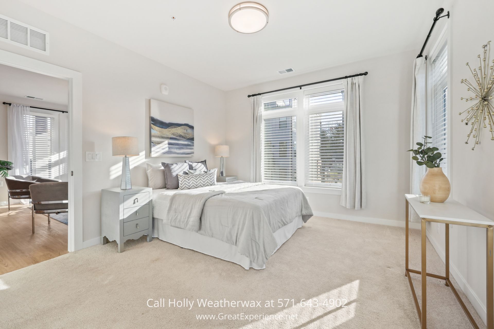 Reston VA Condo - Serene and spacious primary suite of an elegant condo unit, showcasing plush amenities and tasteful decor near Lake Anne Plaza, Reston a bedroom with a bed, desk, and two windows