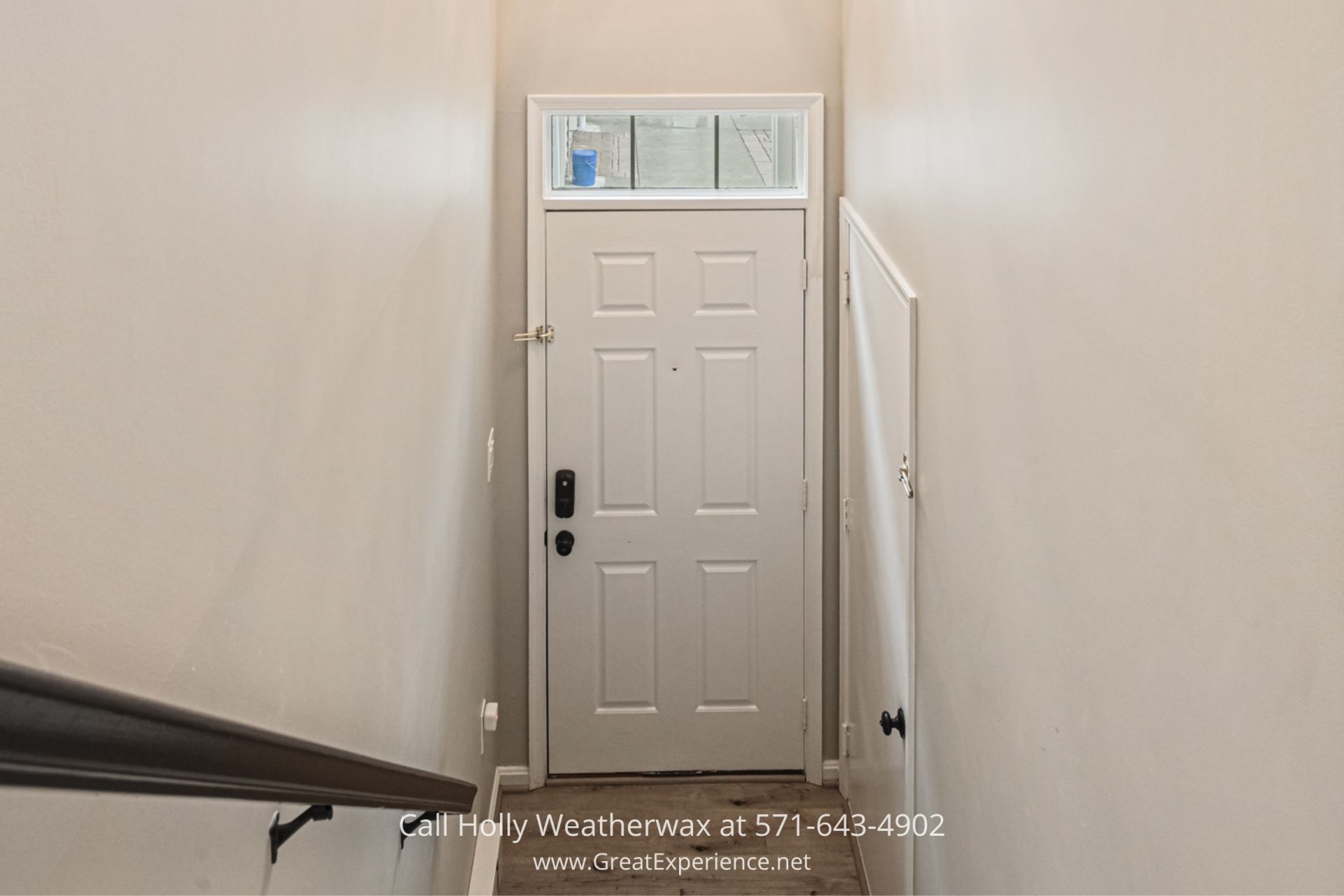 Reston VA Condo with Private Garage a hallway with a white door and a window