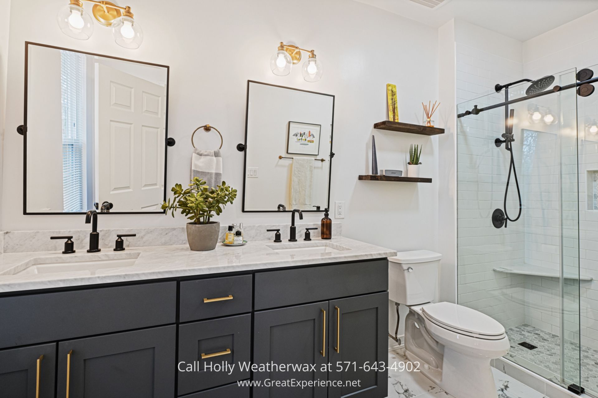 Homes for Sale in Reston VA a bathroom with two sinks, a toilet and a shower